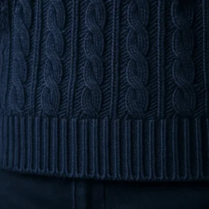hem detail of navy cable knit sweater pullovers