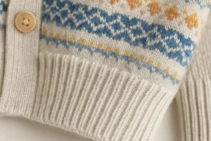 cuff hem button detail of light color Fair Isle Cardigan
